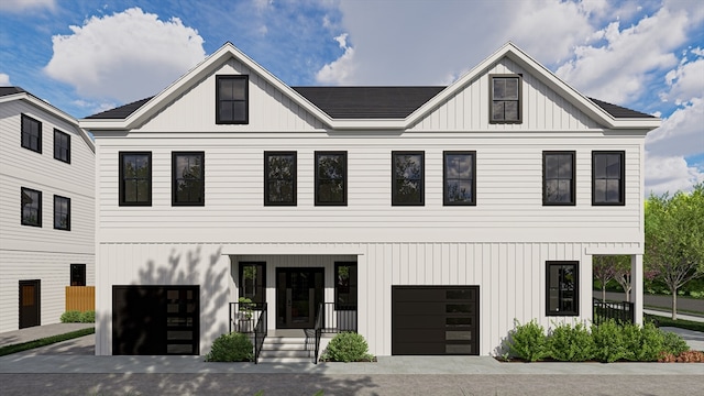 modern inspired farmhouse with a garage and covered porch