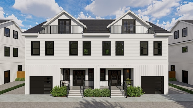 modern farmhouse style home with a porch and a garage