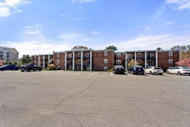 view of property with uncovered parking