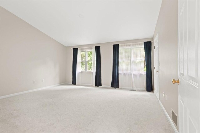 29 Crystal Brook Way Unit C, Marlborough, MA 01752 - unfurnished room with light carpet and lofted ceiling