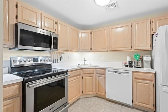 29 Crystal Brook Way Unit C, Marlborough, MA 01752 - kitchen featuring stainless steel appliances, light brown cabinetry, light countertops, and light tile patterned floors