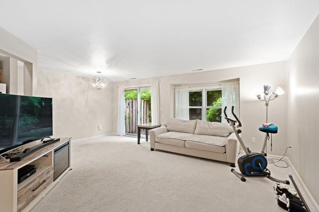 29 Crystal Brook Way Unit C, Marlborough, MA 01752 - living area featuring a chandelier and carpet