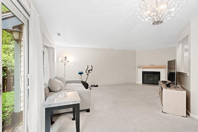 29 Crystal Brook Way Unit C, Marlborough, MA 01752 - living area featuring a fireplace with flush hearth, a chandelier, and light colored carpet