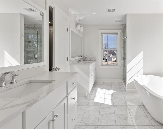 bathroom with a sink, two vanities, marble finish floor, and a stall shower