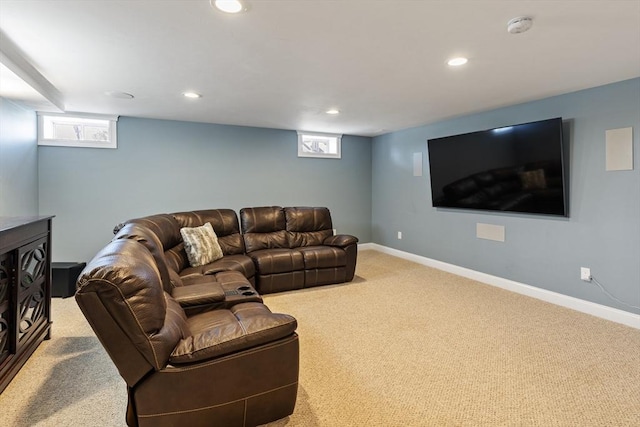 carpeted living area with recessed lighting and baseboards