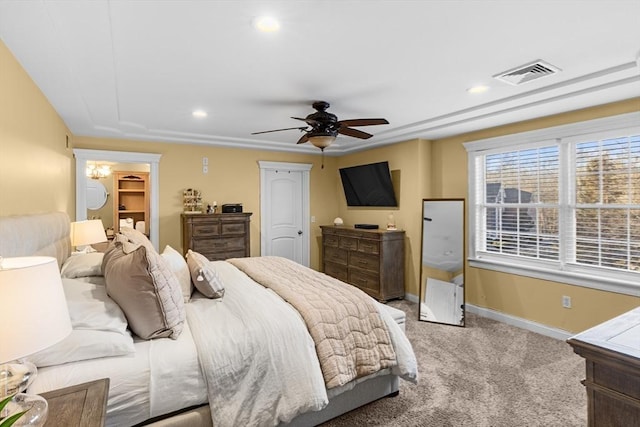 bedroom with ceiling fan and light carpet