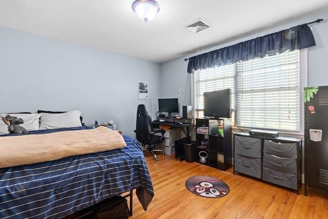 bedroom featuring wood-type flooring