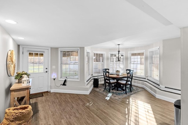 interior space with a chandelier and hardwood / wood-style flooring