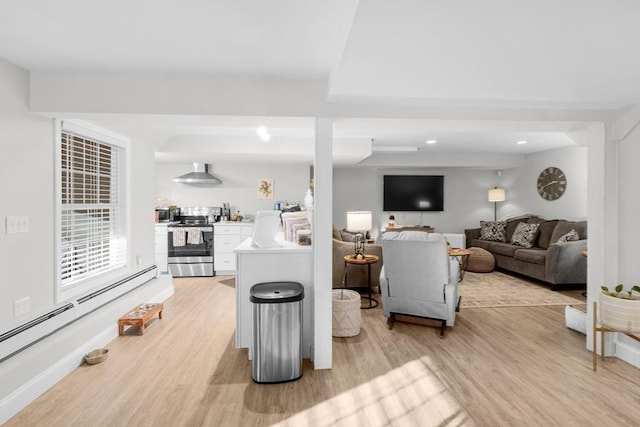 living room featuring light wood-type flooring and a baseboard radiator