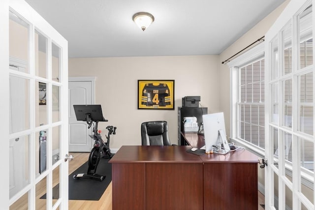 office area featuring french doors and light hardwood / wood-style flooring