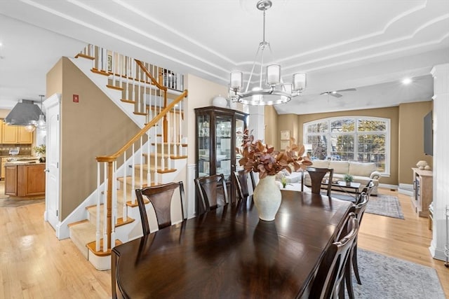 dining room featuring light hardwood / wood-style flooring and an inviting chandelier