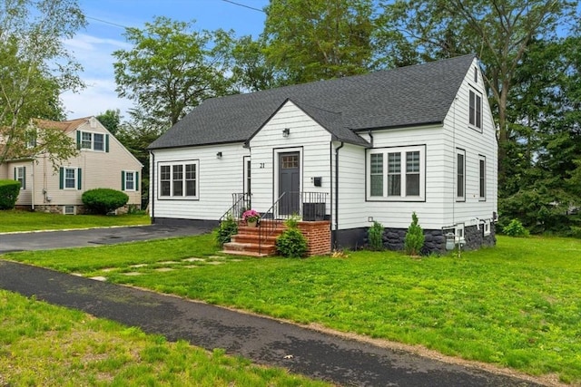 21 Pembrook Rd, North Andover, MA 01845 - view of front of house with a front yard and roof with shingles