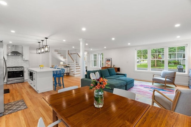 21 Pembrook Rd, North Andover, MA 01845 - dining room featuring stairs, light wood-style floors, recessed lighting, and ornate columns