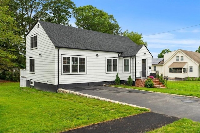 21 Pembrook Rd, North Andover, MA 01845 - view of front of home featuring a front lawn and a shingled roof