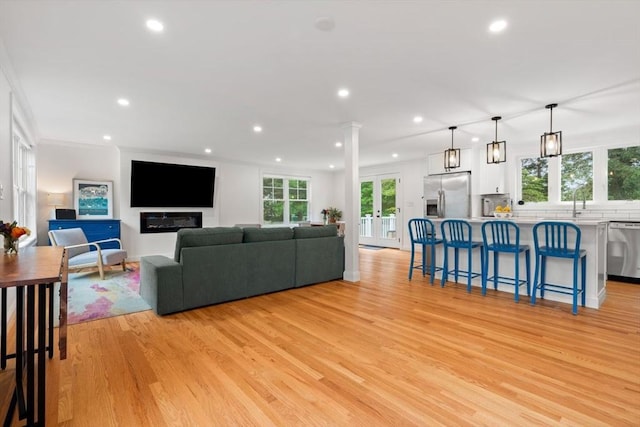 21 Pembrook Rd, North Andover, MA 01845 - living room featuring light wood-style floors, recessed lighting, and ornamental molding