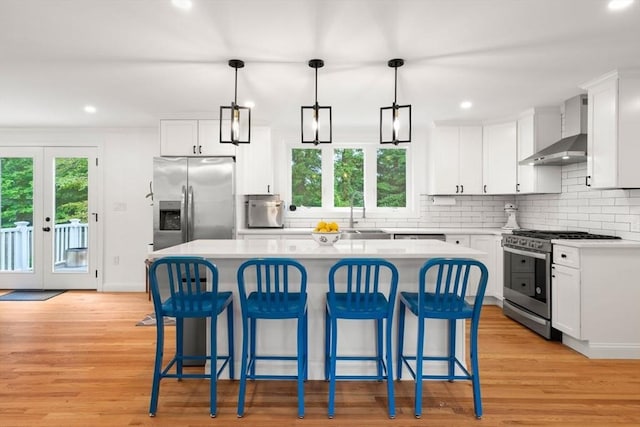 21 Pembrook Rd, North Andover, MA 01845 - kitchen featuring wall chimney exhaust hood, appliances with stainless steel finishes, healthy amount of natural light, light countertops, and recessed lighting