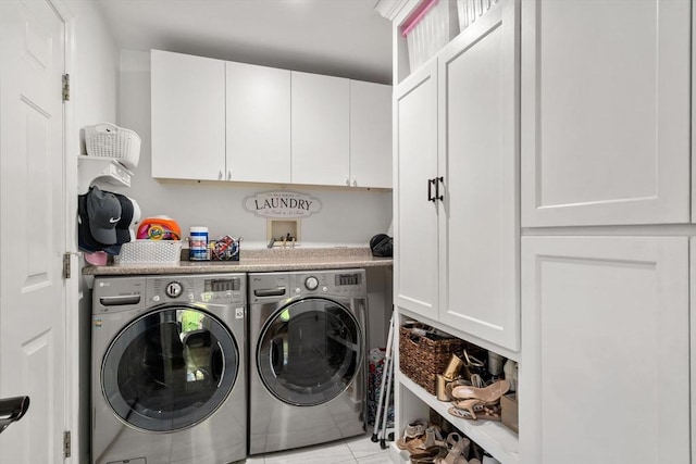 10 Primrose Ln, Westborough, MA 01581 - laundry area with cabinet space, separate washer and dryer, and light tile patterned floors