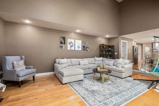 10 Primrose Ln, Westborough, MA 01581 - living room with light wood-type flooring, a towering ceiling, baseboards, and recessed lighting