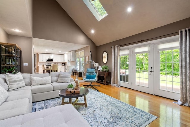10 Primrose Ln, Westborough, MA 01581 - living area with high vaulted ceiling, light wood-style floors, a skylight, healthy amount of natural light, and recessed lighting