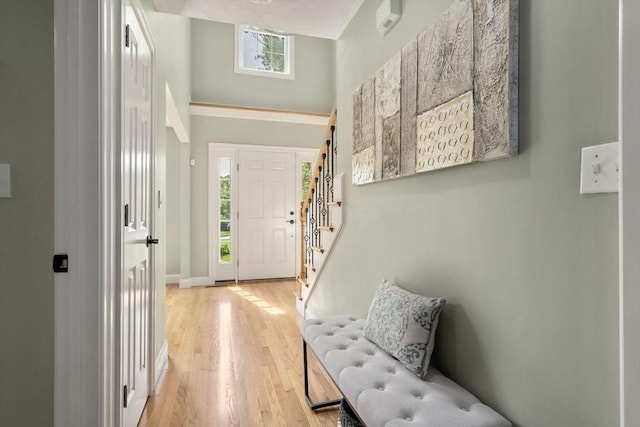 10 Primrose Ln, Westborough, MA 01581 - entrance foyer with light wood-style floors, stairs, healthy amount of natural light, and baseboards