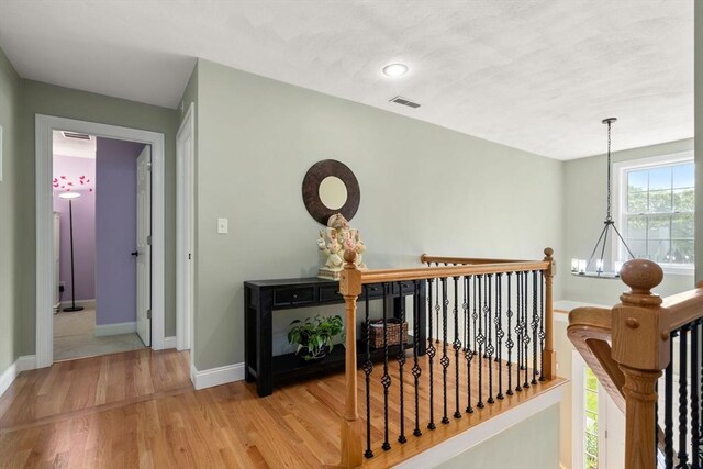 10 Primrose Ln, Westborough, MA 01581 - hall featuring wood finished floors, an upstairs landing, and baseboards