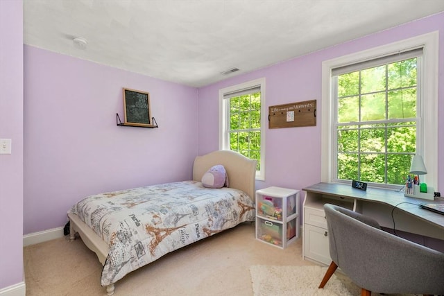 10 Primrose Ln, Westborough, MA 01581 - bedroom with a desk, light carpet, and baseboards