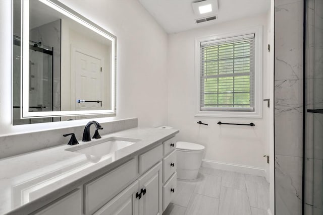 10 Primrose Ln, Westborough, MA 01581 - full bathroom with a marble finish shower, vanity, baseboards, and toilet