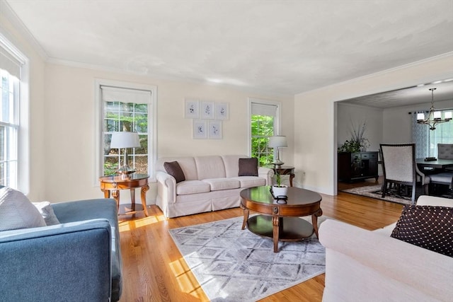 10 Primrose Ln, Westborough, MA 01581 - living area featuring crown molding, a chandelier, and wood finished floors
