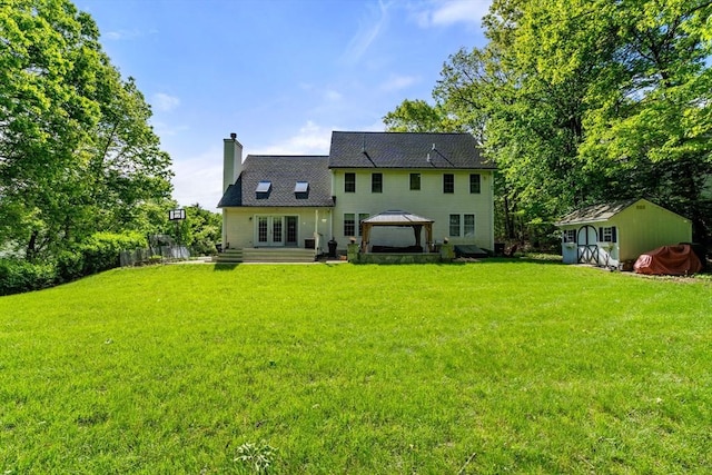 10 Primrose Ln, Westborough, MA 01581 - back of house with a gazebo, a chimney, a lawn, and french doors
