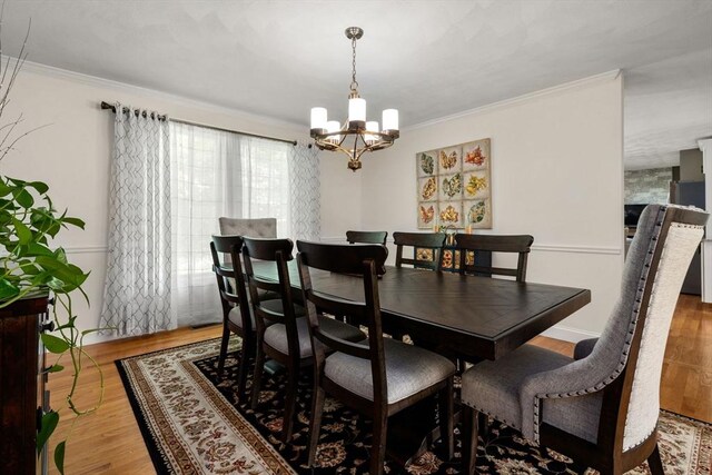 10 Primrose Ln, Westborough, MA 01581 - dining area with a chandelier, wood finished floors, and crown molding