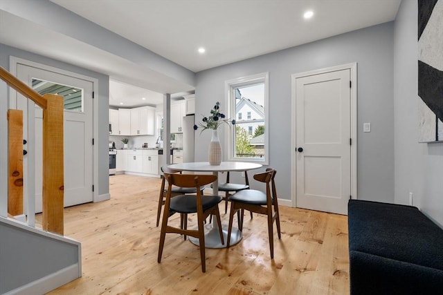 dining area featuring recessed lighting and light wood-type flooring