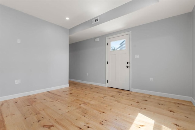 entryway with baseboards, recessed lighting, light wood finished floors, and visible vents