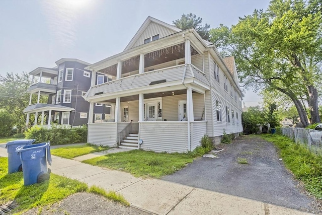 16 Worthen St, West Springfield, MA 01089 - view of front of home with a balcony, a porch, and stairway