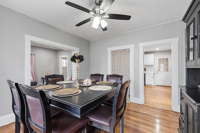 dining area featuring ceiling fan and light hardwood / wood-style flooring