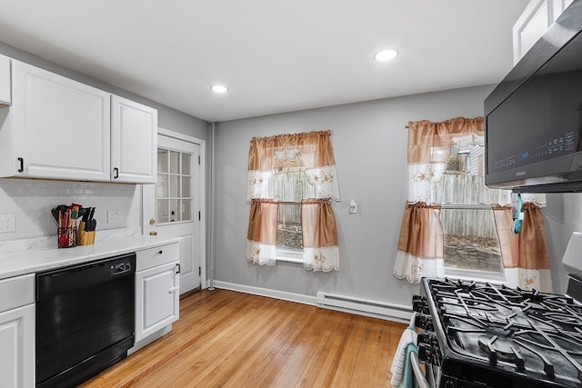 kitchen featuring white cabinetry, dishwasher, light hardwood / wood-style flooring, and a baseboard heating unit