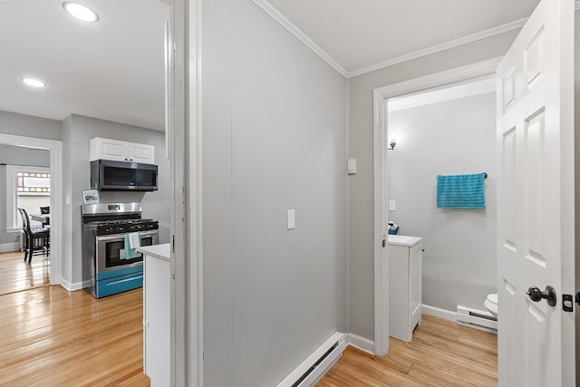 corridor with light wood-type flooring, crown molding, and a baseboard heating unit