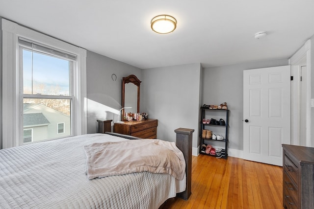 bedroom with light hardwood / wood-style flooring