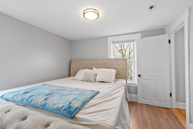 bedroom featuring hardwood / wood-style floors