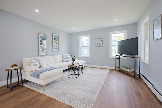 18 Beaumont Rd, Worcester, MA 01604 - living room with baseboard heating, wood finished floors, baseboards, and recessed lighting