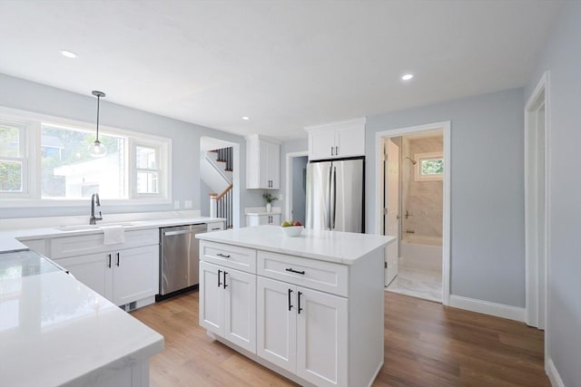 18 Beaumont Rd, Worcester, MA 01604 - kitchen with stainless steel appliances, a sink, healthy amount of natural light, light wood-type flooring, and recessed lighting