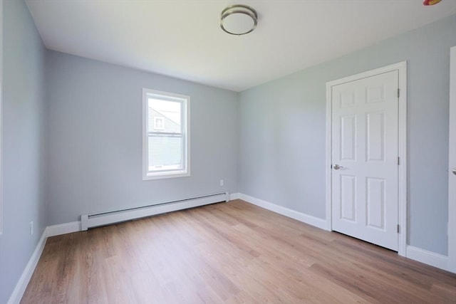 18 Beaumont Rd, Worcester, MA 01604 - unfurnished room featuring a baseboard heating unit, light wood-type flooring, and baseboards