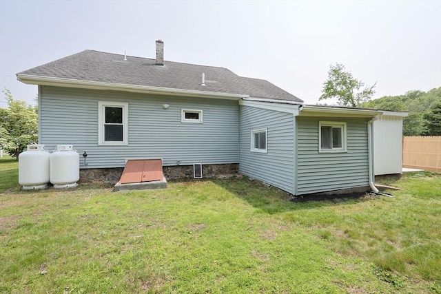 18 Beaumont Rd, Worcester, MA 01604 - rear view of property with a yard and a chimney