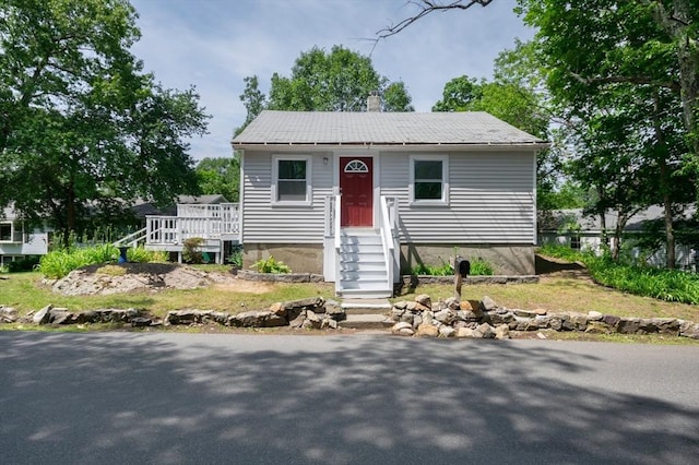 147 Fairmount Ave, Lynn, MA 01905 - bungalow-style home featuring a deck and a chimney