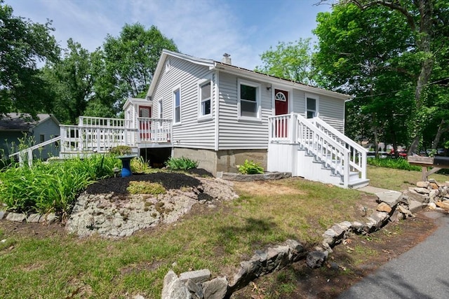 147 Fairmount Ave, Lynn, MA 01905 - view of front facade featuring a chimney and a wooden deck