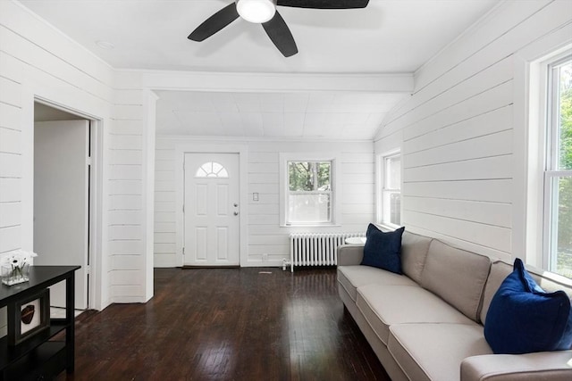 147 Fairmount Ave, Lynn, MA 01905 - foyer featuring radiator, wood-type flooring, wooden walls, a ceiling fan, and vaulted ceiling