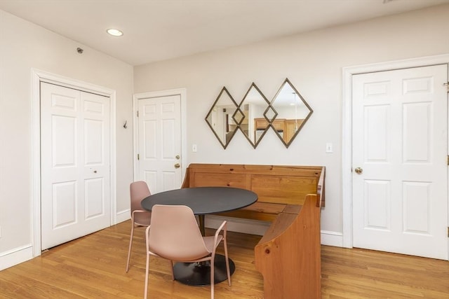 dining space with light hardwood / wood-style floors