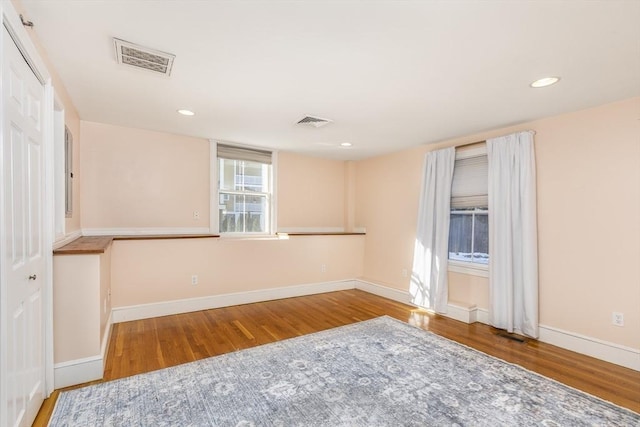 spare room featuring light hardwood / wood-style flooring