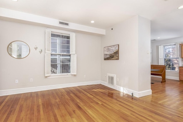 spare room with hardwood / wood-style floors