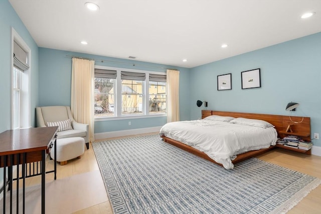 bedroom featuring recessed lighting, light wood-type flooring, and baseboards