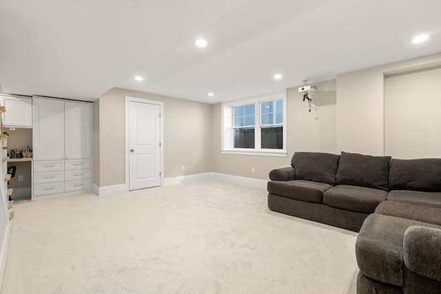 living room featuring recessed lighting, light colored carpet, and baseboards